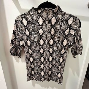 Ruffle hem snake skin fitted turtleneck short sleeved top- caution to the wind